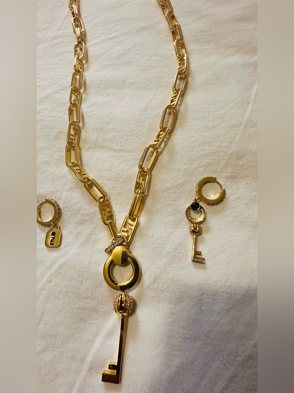 Sale‼️Gold Key Pendant Necklace and asymmetrical Hoop Earrings - inspired